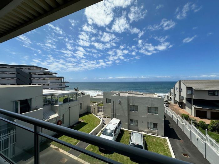 For Sale: Beachfront Apartment in Ballito Central with ocean views and garage.