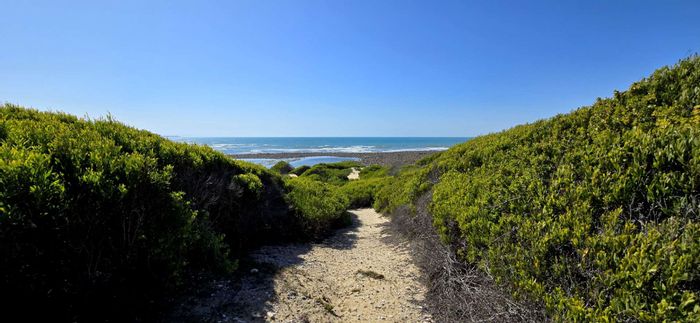 Farm for Sale in Mossel Bay Rural: Coastal views, borehole, and development potential.