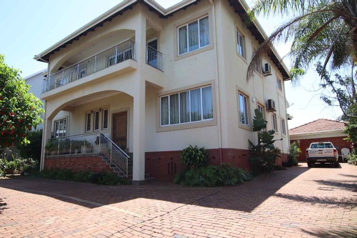 Spacious 5-bedroom house with pool, sea views, and ample parking in Durban North Central.