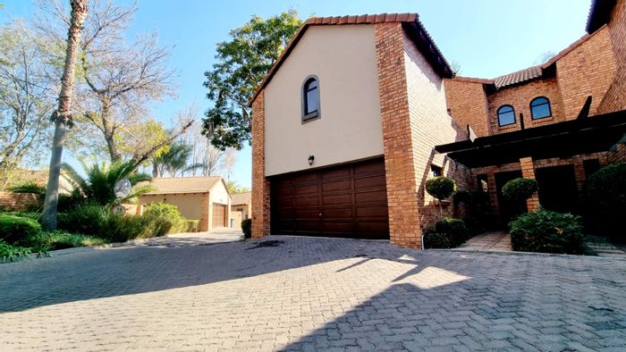 For Sale: Equestria Townhouse with 4 bedrooms, private garden, and double garage.