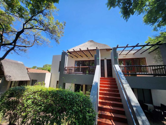 For Sale: Apartment in Jukskei Park with patio, pools, gardens, and restaurant.