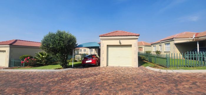 For Sale: Elandspark Townhouse with private garden, 24-hour security, and garage.