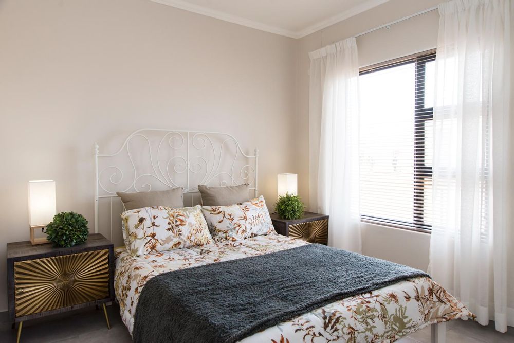 Second bedroom with built-in cupboards.