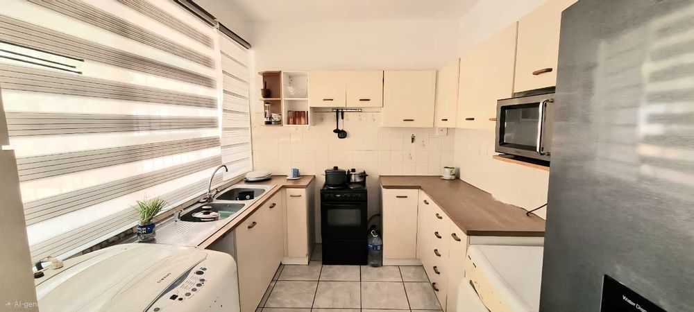 Neat kitchen with lots of cupboards
