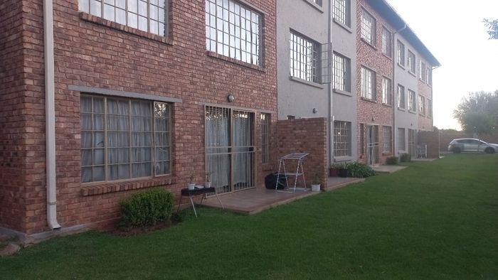 For Sale: Townhouse in Hughes with 2 bedrooms, parking, and investment potential.