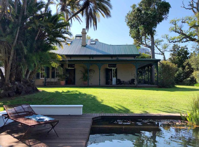 Historic Belle Ombre house for sale: gardens, pools, tennis court, and cottage.