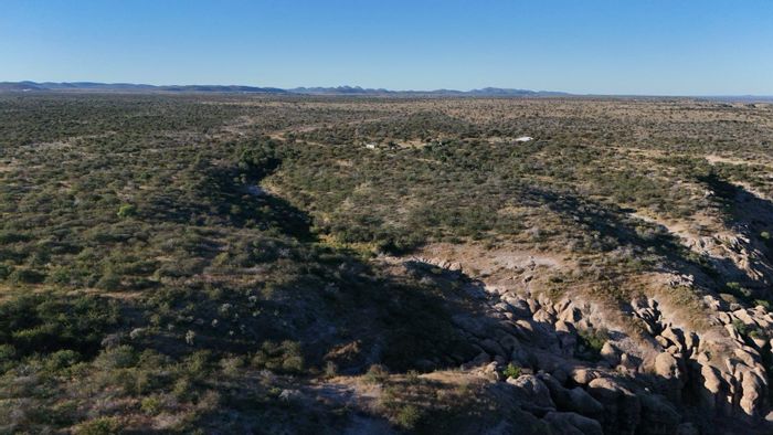 Farm for Sale in Outjo Central: Off-grid living, borehole, solar power, secure fencing.