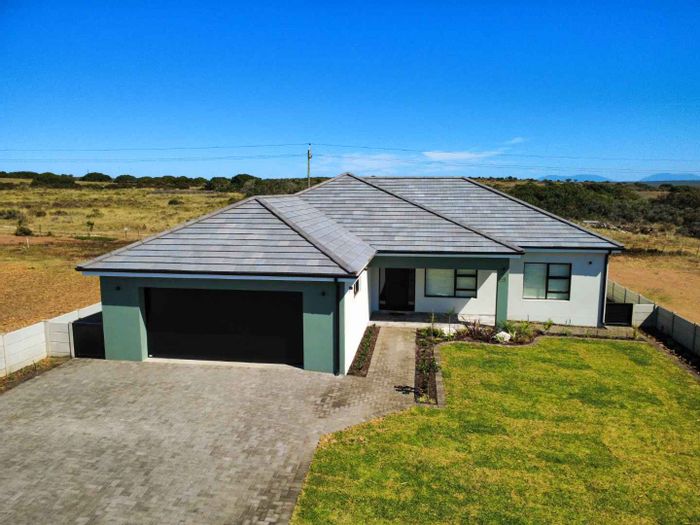 For Sale: House in Still Bay West with open-plan living, indoor braai, and double garage.