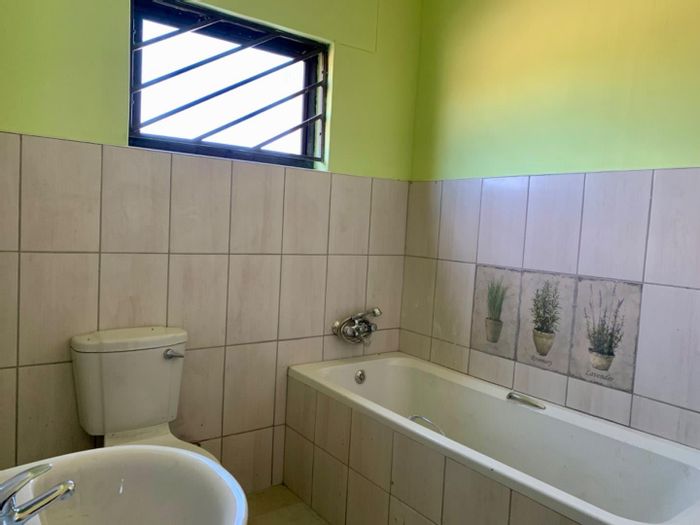 For Sale: House in Okahandja Central with 3 bedrooms, boundary walls, and veranda.