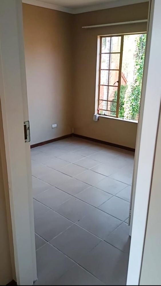 Newly Tiled Main Bedroom