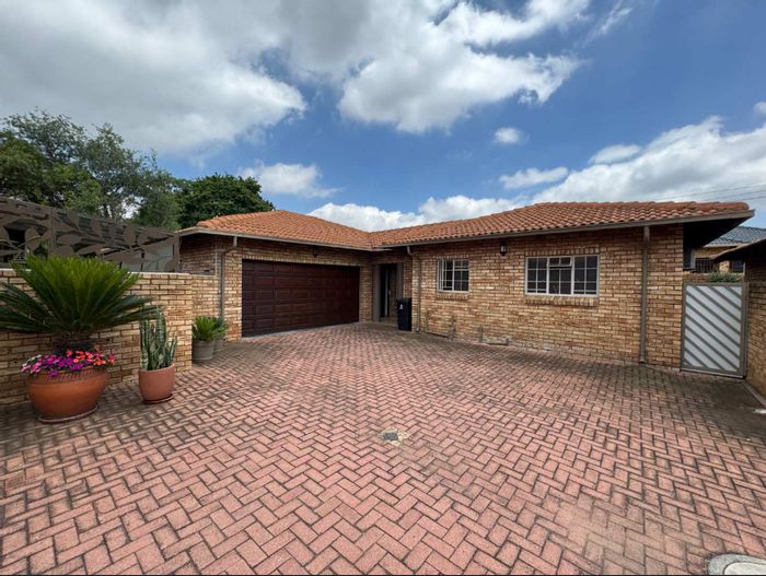 For Sale: Townhouse in New Redruth with private garden, double garage, and security features.