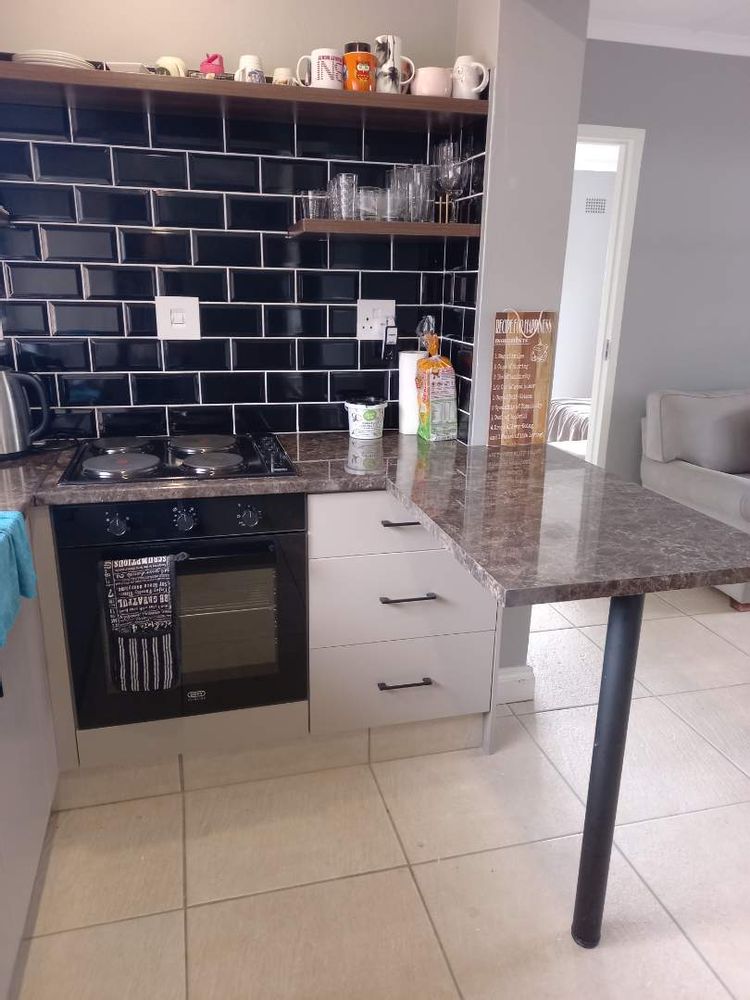 Flatlet kitchen area and breakfast counter