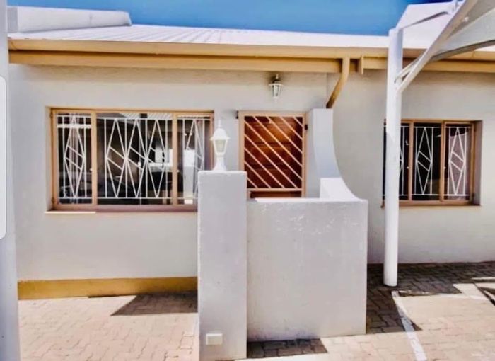 For Sale: Rocky Crest Townhouse with 2 Bedrooms, Courtyard, and Shaded Parking.