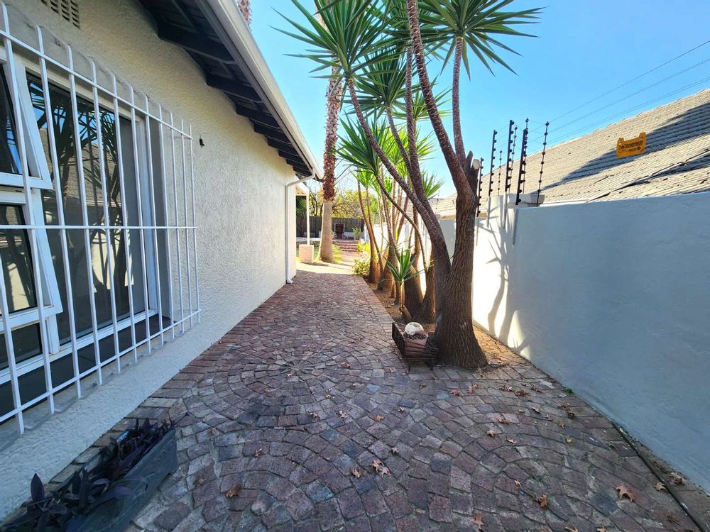 paved side walk to the yard