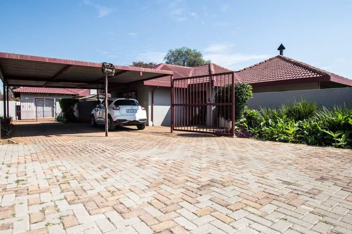 4 Bedroom House to Rent in Birch Acres with pool, braai area, and carport.