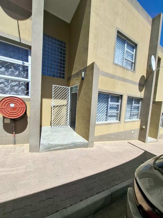 For Sale: Townhouse in Otjomuise Ext 4 with 3 bedrooms, parking, and security.