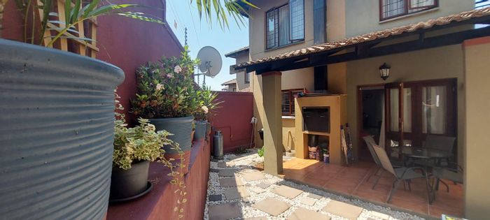 Sonheuwel Townhouse For Sale: Small garden, built-in braai, close to amenities.