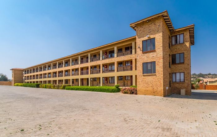 For Sale: Apartment in Krugersdorp Central with security, balcony, and prepaid utilities.