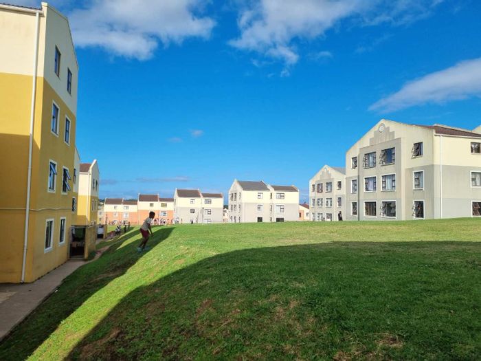 2-Bedroom Apartment For Sale in Amalinda with secure complex and play areas.