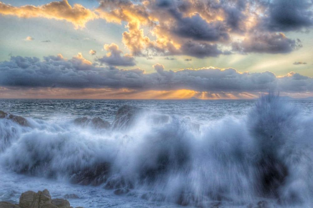 SUNSET View of ocean breaking into pool at Spring High Tide (amateur photo)