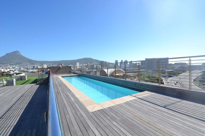 Zonnebloem Apartment For Sale: Rooftop pool, gym, secure parking, and rental income potential.