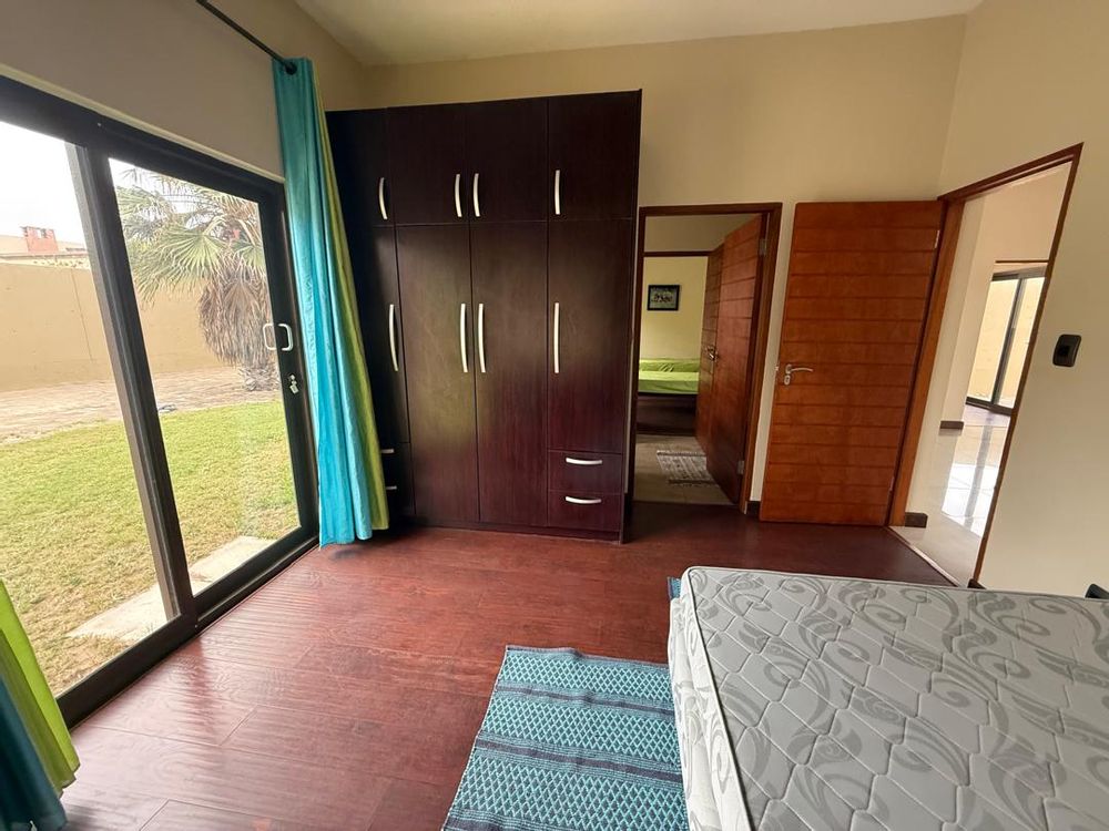 Ground floor, bedroom three, built-in cupboards and shared bathroom