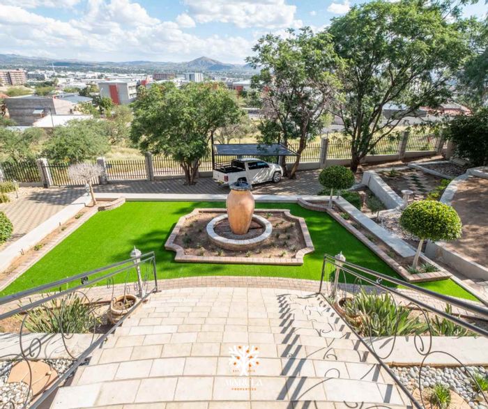 For Sale: Spacious 5-bedroom house with pool, tennis court, and city views in Windhoek Central.