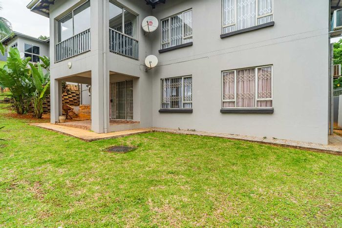 For Sale: Sunningdale Townhouse with garden, double garage, park access, and security.