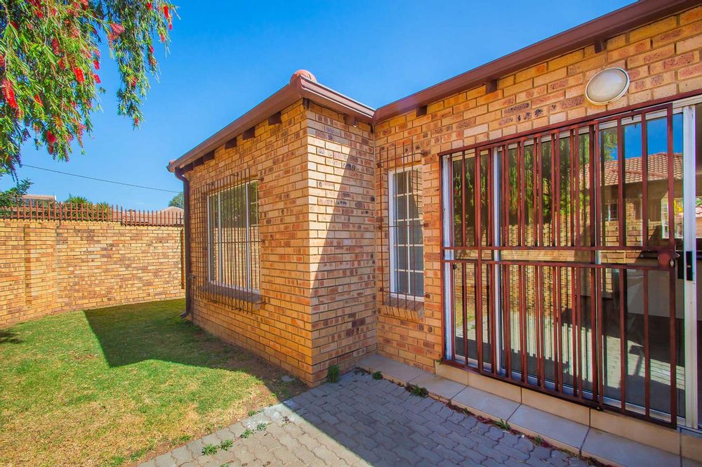 Entrance to unit with wrap round garden