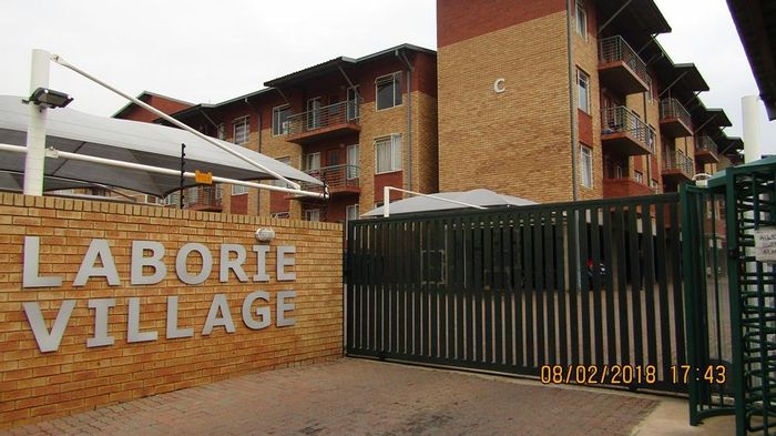 Braamfontein Werf Apartment To Rent: Balcony, communal pool, braai area, laundry facilities.