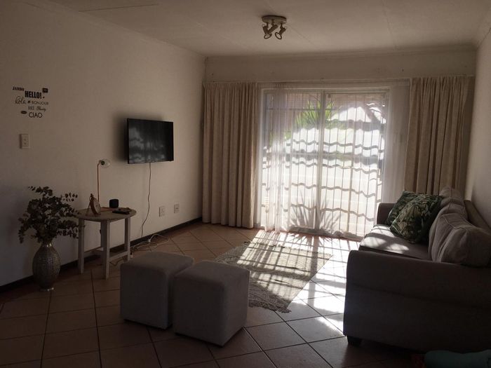 For Sale: 2-Bedroom Apartment in Die Hoewes with Double Garage and Security Features.