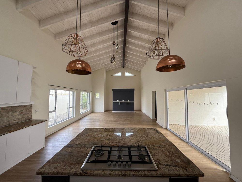 Open-plan kitchen, living, and dining area