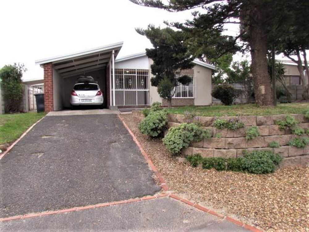 Front of house showing long driveway with plenty of parking and car port