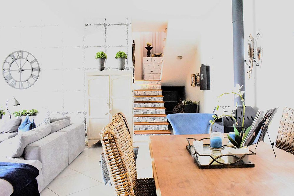 Ground floor open plan dining and living area with interconnected stairs coming down