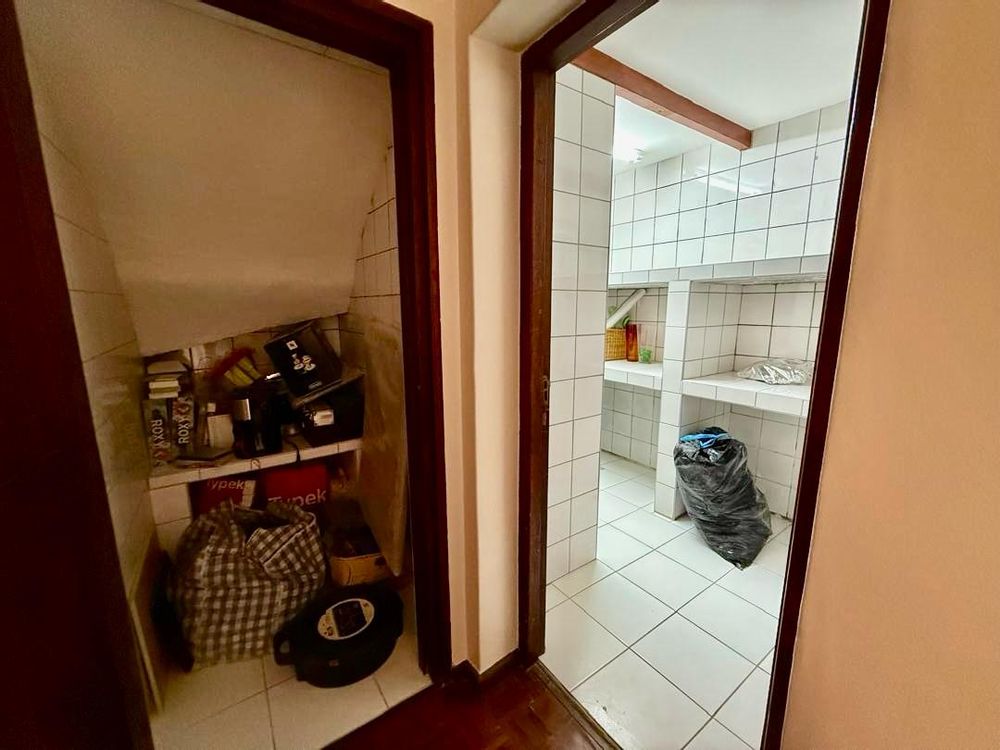 Storage under the stairs and another storage/ laundry room