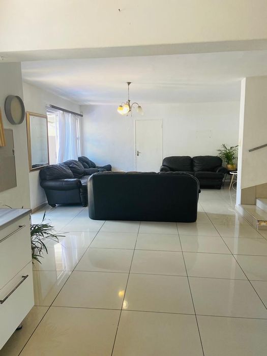 Townhouse for Sale in Avis: 3 bedrooms, garage, private yard, open-plan living.