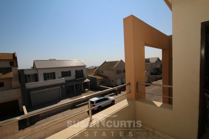 For Sale: Long Beach Townhouse with 3 beds, BBQ area, and tandem garage.