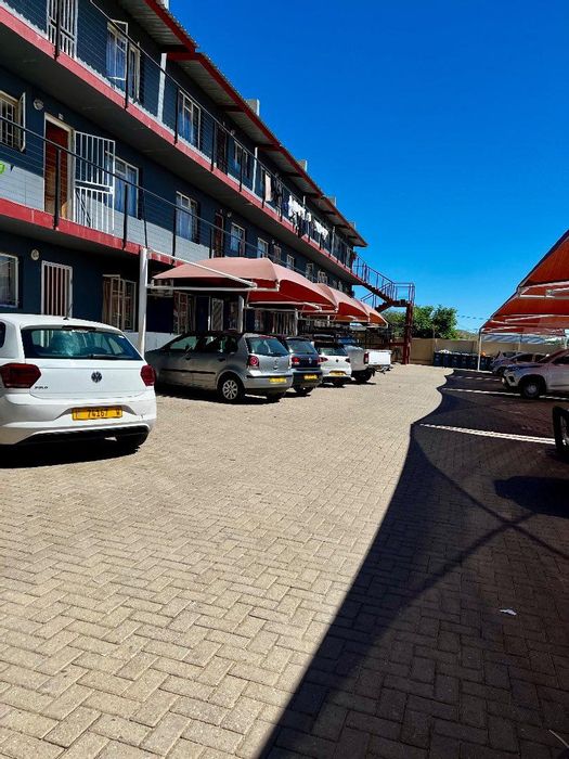 For Sale: Apartment in Otjomuise with balcony, two bedrooms, and sunset views.