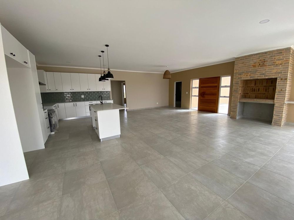 Open plan kitchen, lounge and dining room with an indoor BBQ