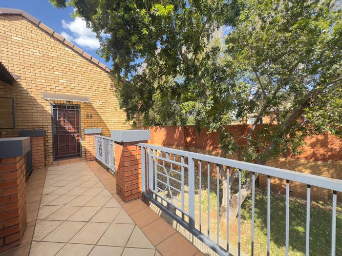 For Sale: Equestria Townhouse with pool, tennis court, and secure parking.
