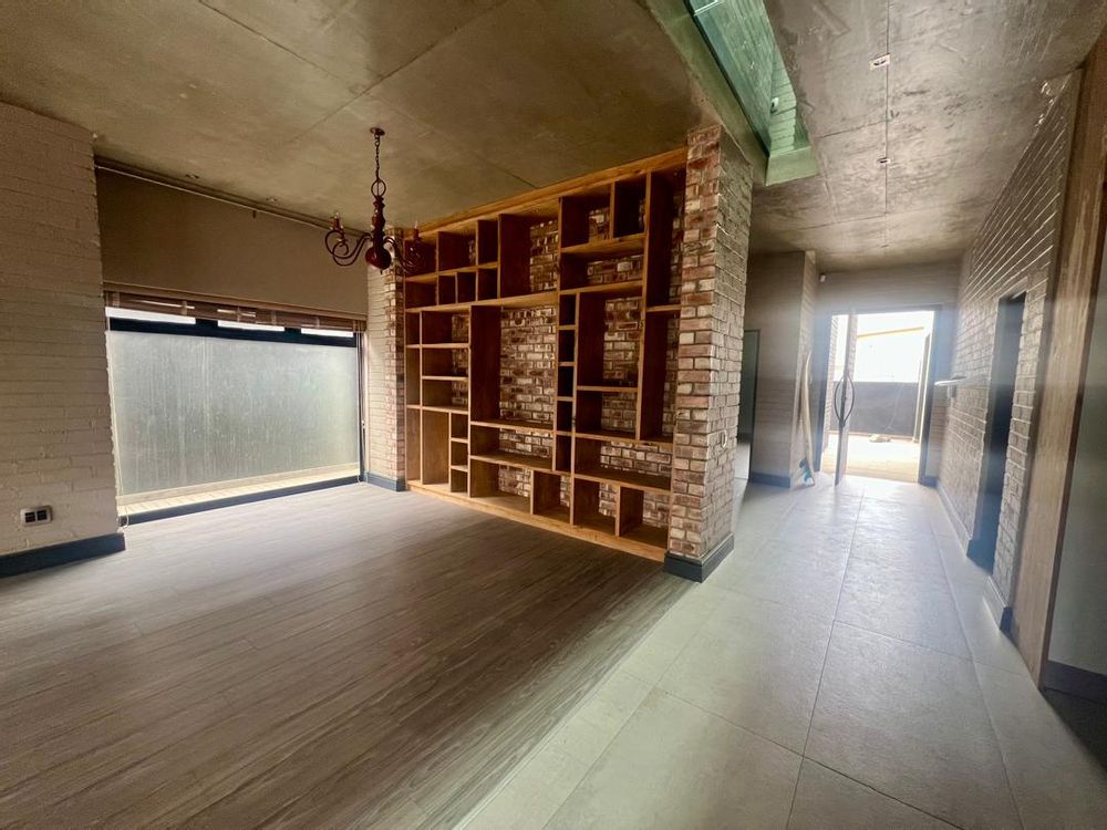 Entrance hallway and built-in shelves in lounge area