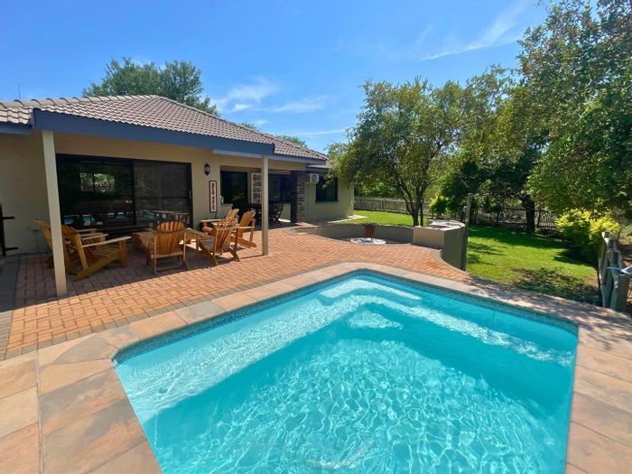 House for Sale in Hoedspruit Wildlife Estate with pool, study, and outdoor living.