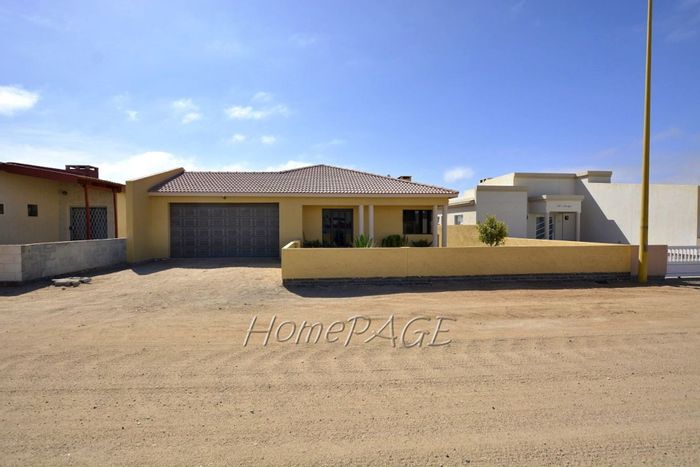 For Sale: House in Henties Bay Central with 3 bedrooms, double garage, and indoor BBQ.