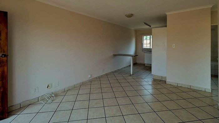 Faerie Glen Apartment To Rent: Two bedrooms, pool access, secure parking, and DSTV-ready.