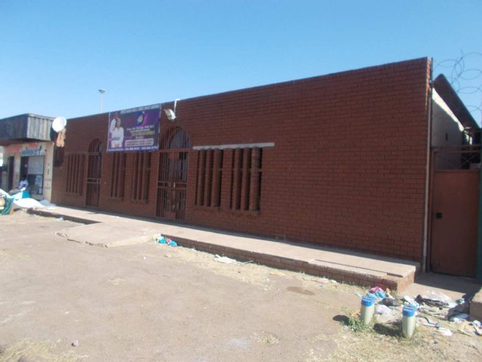 Business Property For Sale in Radebe: Versatile Space with Office and Restrooms.