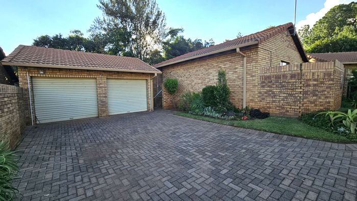 3-Bedroom Townhouse To Rent in Die Hoewes with patio, braai, and double garages.