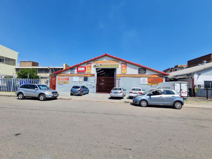Versatile business property in New Centre with warehouse, parking, and utilities. For Sale.