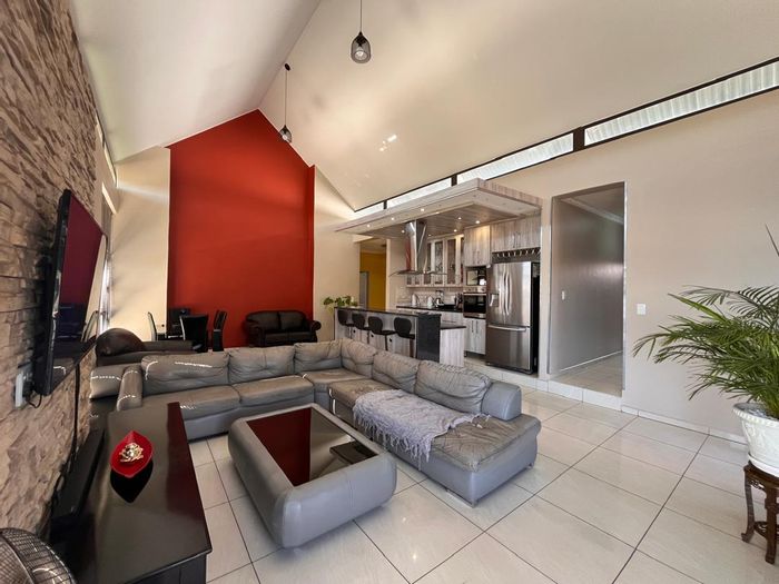 For Sale: House in Elisenheim with open-plan living, 3 bedrooms, and double garage.