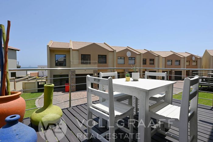 Dolphin Beach Townhouse For Sale: Open-plan living, built-in braai, private balcony.