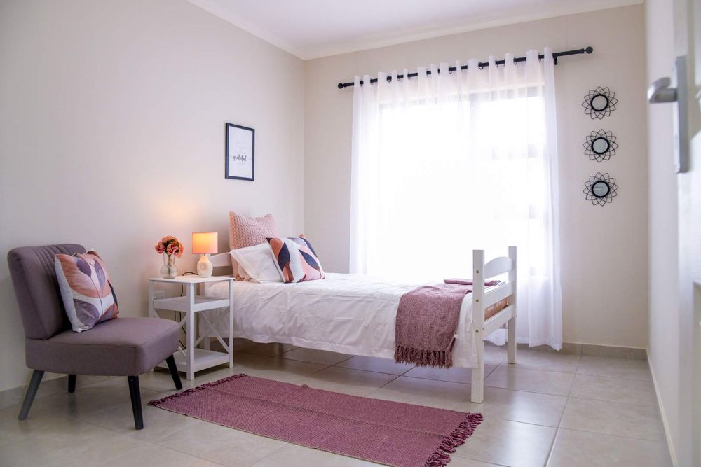 Fourth bedroom with built-in cupboards.